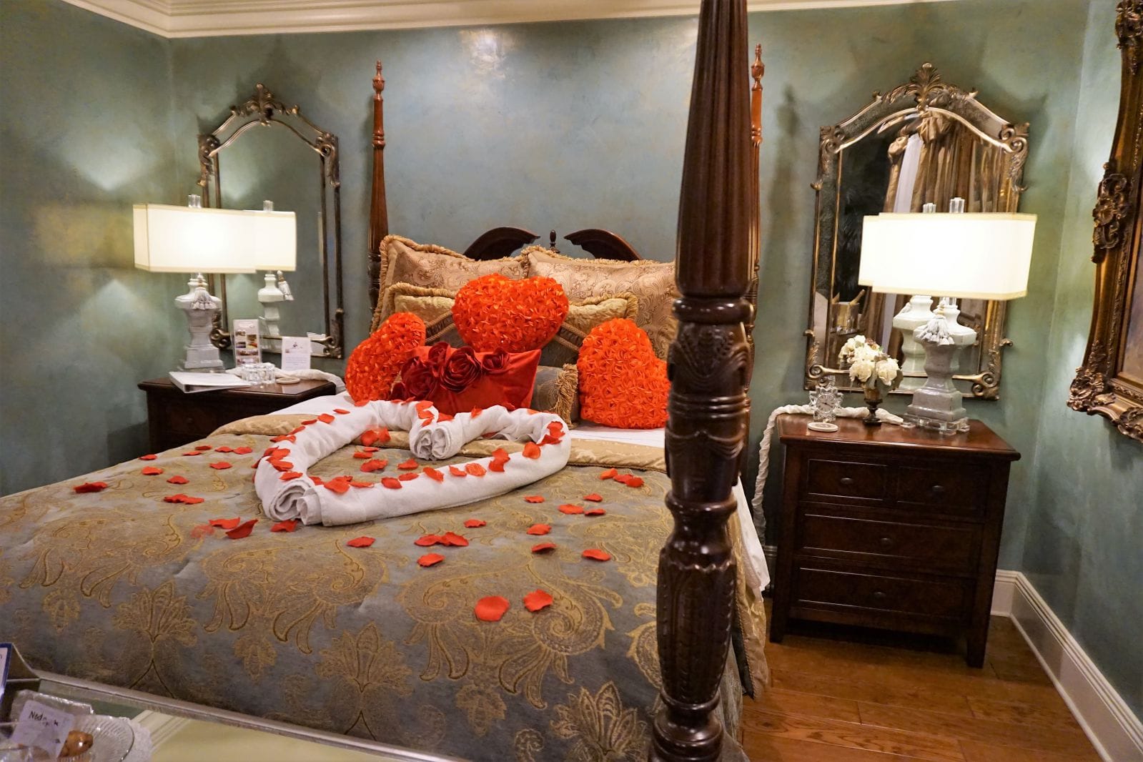 Bridal suite with rose pedals on the bed at louisiana cajun mansion bed and breakfast